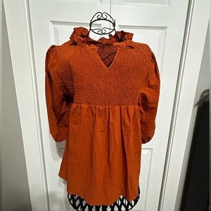 unbranded size women’s small NW/OT rust colored top